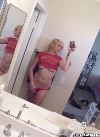 Cute blonde girlfriend takes selfshot pictures of her perky tits and tight little ass