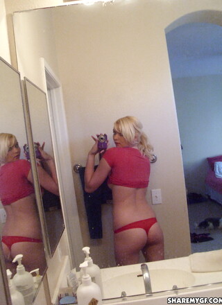 Cute blonde girlfriend takes selfshot pictures of her perky tits and tight little ass